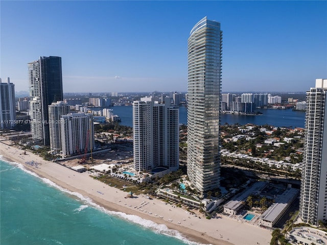 property's view of city featuring a beach view and a water view