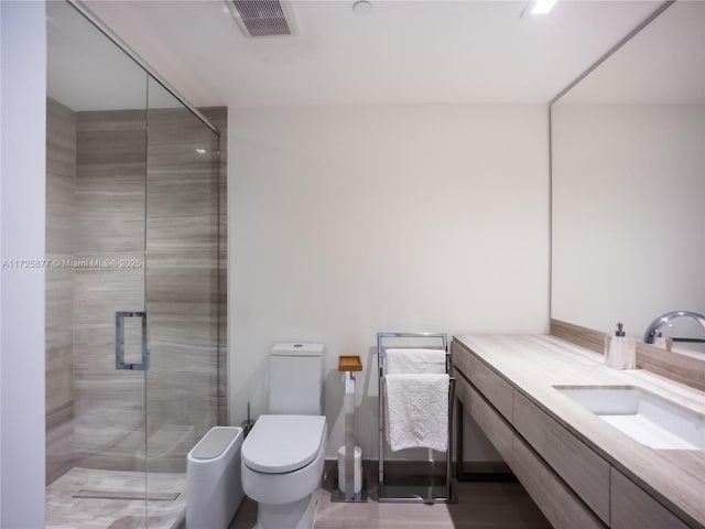 bathroom with walk in shower, vanity, and toilet