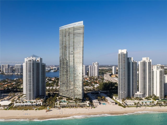 property's view of city with a beach view and a water view