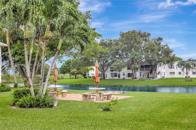 view of yard featuring a patio area and a water view