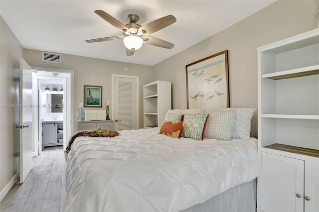 bedroom featuring ceiling fan and light hardwood / wood-style flooring