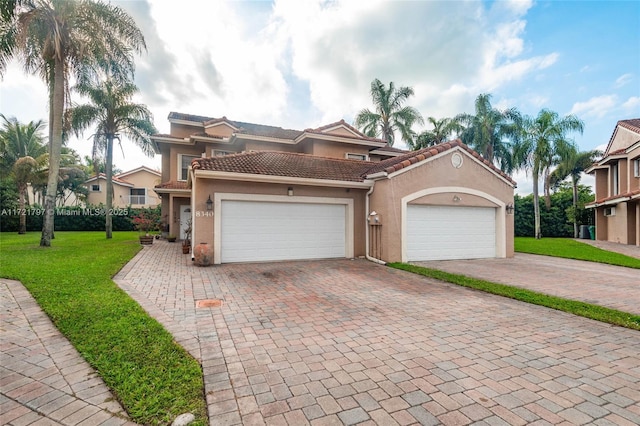 mediterranean / spanish-style house with a front lawn