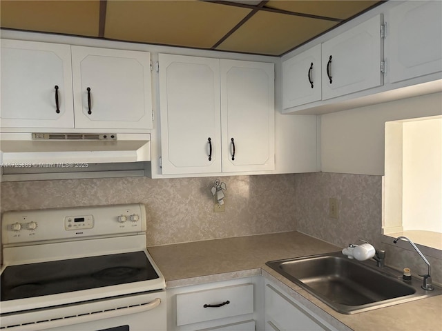 kitchen with sink, white cabinetry, white range with electric stovetop, and tasteful backsplash