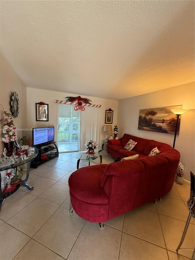 living room with tile patterned flooring and a textured ceiling