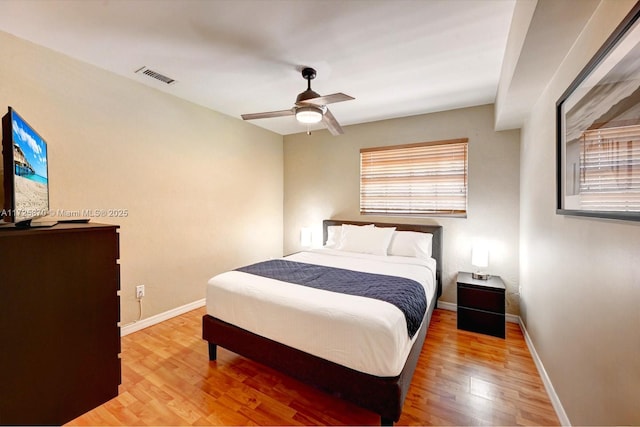 bedroom with ceiling fan and wood-type flooring