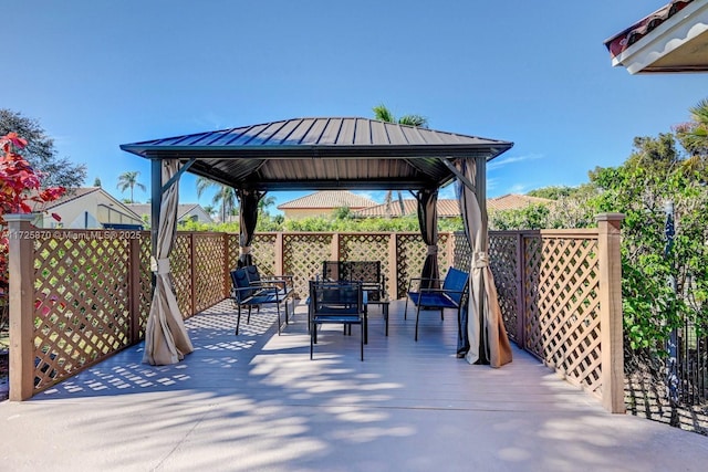 view of patio / terrace with a deck and a gazebo