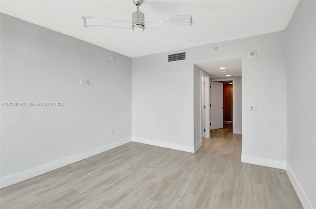 unfurnished room with light hardwood / wood-style flooring