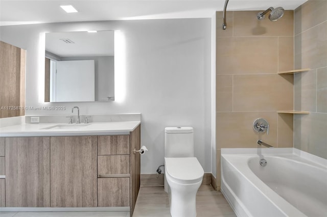 full bathroom with toilet, vanity, and tiled shower / bath combo