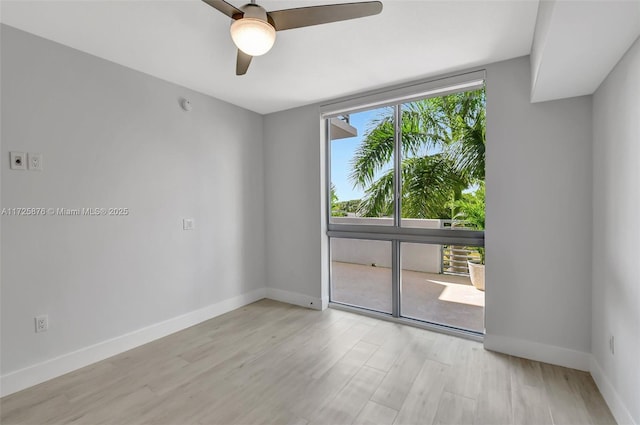 spare room featuring ceiling fan and light wood-type flooring