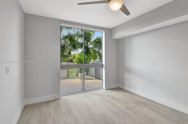 unfurnished room featuring ceiling fan and light hardwood / wood-style flooring