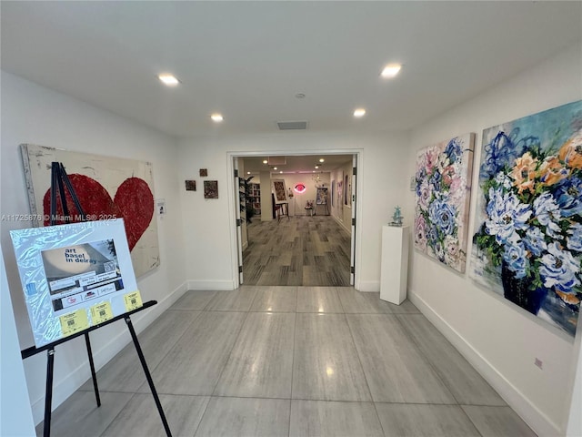 corridor featuring hardwood / wood-style flooring