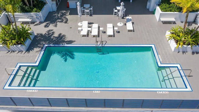 view of swimming pool with a patio area