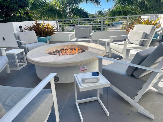 view of patio / terrace featuring an outdoor fire pit