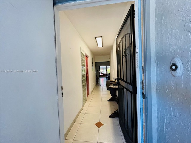 hallway with light tile patterned floors