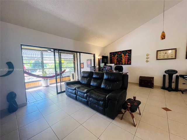 tiled living room with a textured ceiling and lofted ceiling