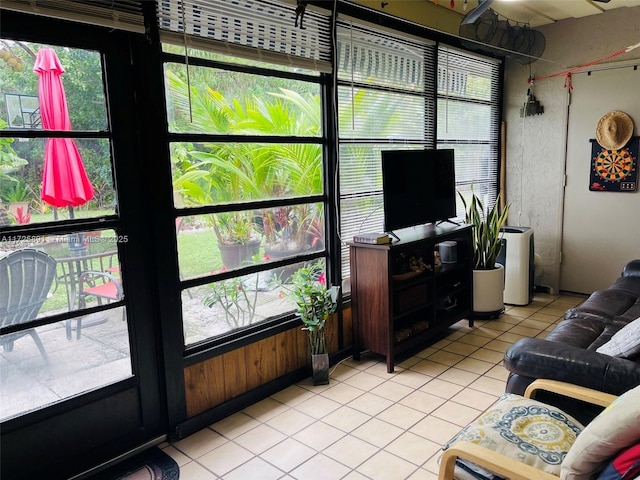 tiled living room with plenty of natural light