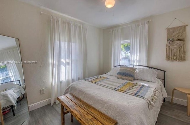 bedroom featuring dark wood-type flooring and ceiling fan