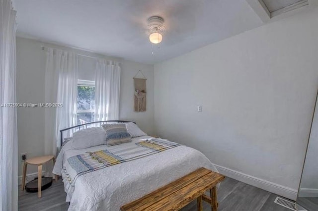 bedroom with ceiling fan and hardwood / wood-style floors