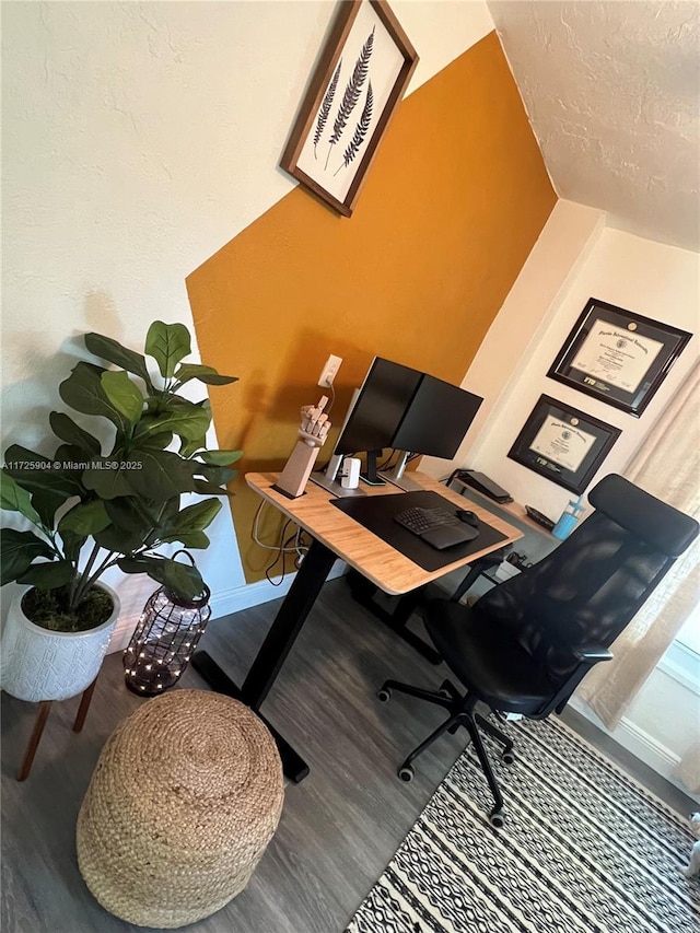 office space featuring hardwood / wood-style flooring and a textured ceiling