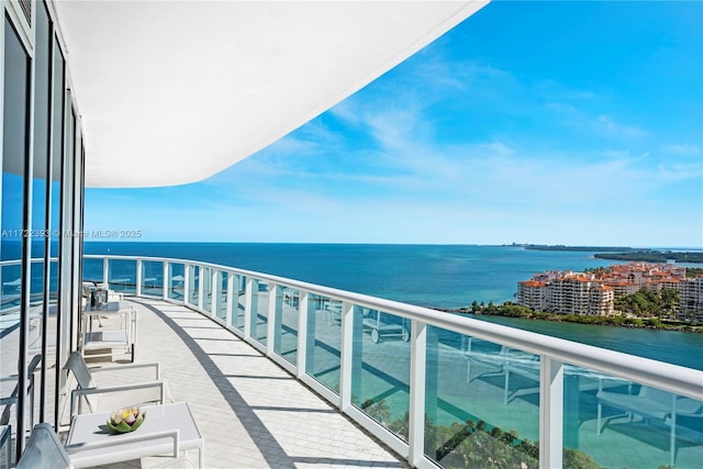 balcony featuring a water view