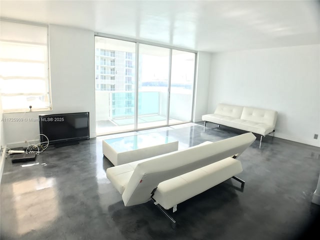 living room with floor to ceiling windows