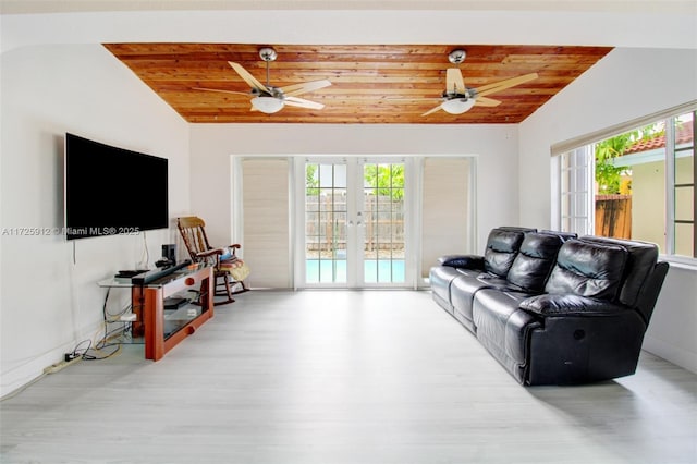 living area featuring light wood-type flooring, french doors, lofted ceiling, and wood ceiling