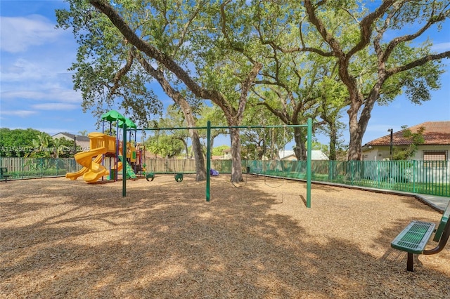 communal playground featuring fence