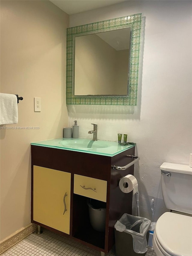 bathroom with vanity and toilet