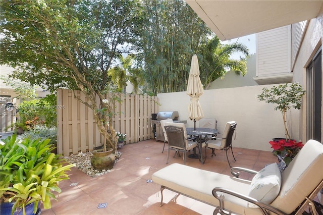 view of patio featuring a grill