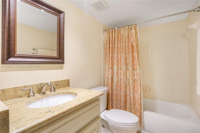 full bathroom featuring toilet, vanity, and shower / bathtub combination with curtain