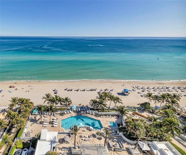 drone / aerial view with a water view and a view of the beach