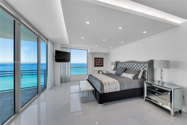 bedroom featuring access to exterior and light tile patterned flooring