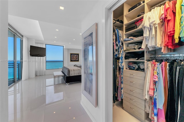 spacious closet featuring light tile patterned floors