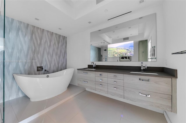 bathroom with separate shower and tub, tile walls, vanity, a tray ceiling, and tile patterned flooring