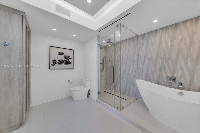 bathroom with tile patterned flooring, separate shower and tub, and toilet