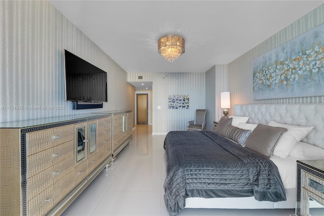 tiled bedroom with a notable chandelier