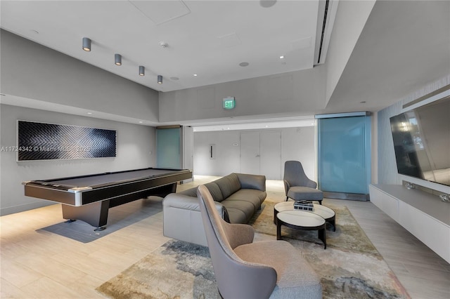 playroom with billiards, light wood-type flooring, and a high ceiling