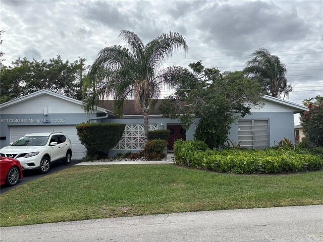 ranch-style house with a front lawn