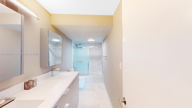 full bathroom with shower / bath combination with glass door, toilet, and vanity