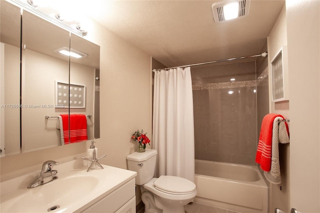 bathroom featuring tile patterned flooring, toilet, vanity, visible vents, and shower / tub combo with curtain