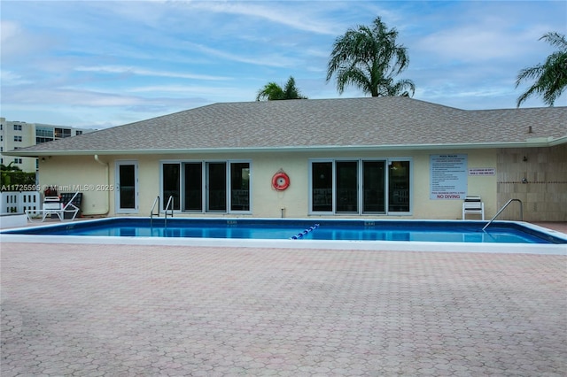 community pool with a patio