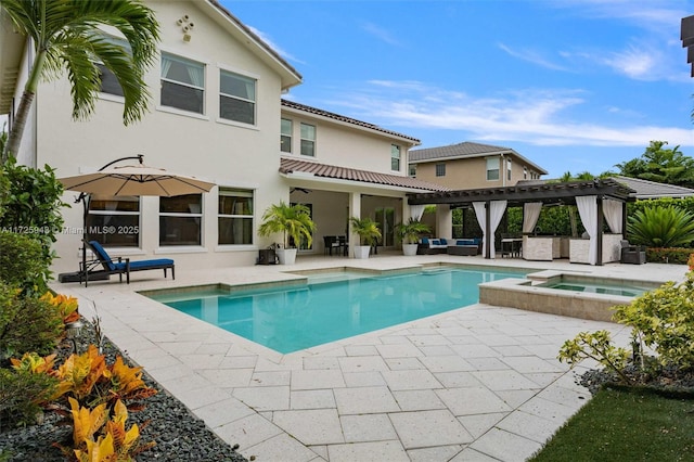 view of swimming pool with a pergola, an in ground hot tub, and a patio