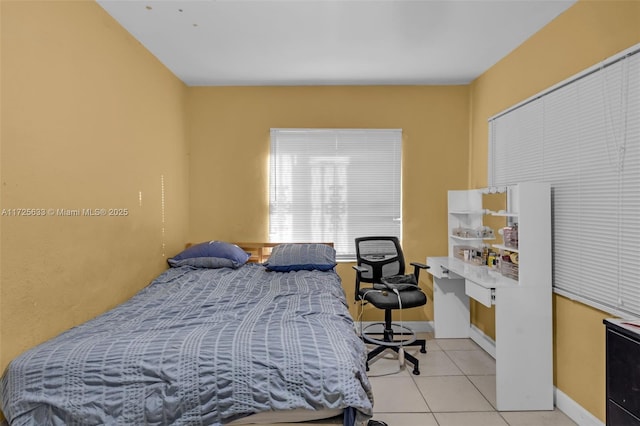 bedroom with light tile patterned flooring