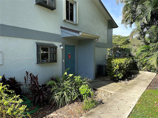 exterior space featuring central AC and stucco siding