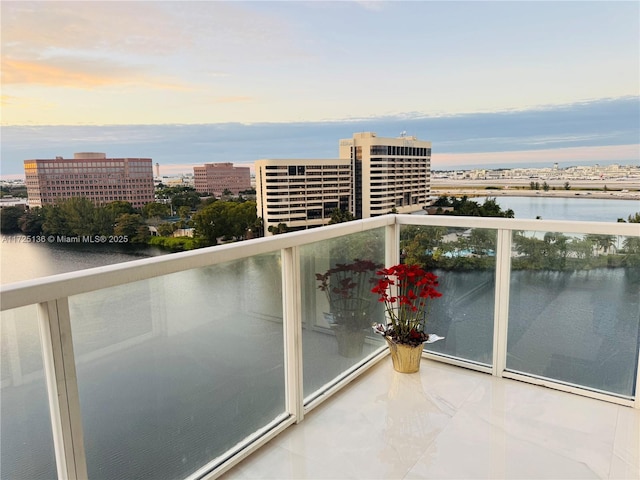 5085 NW 7th St Unit 1101, Miami, FL 33126 - balcony at dusk with a water view