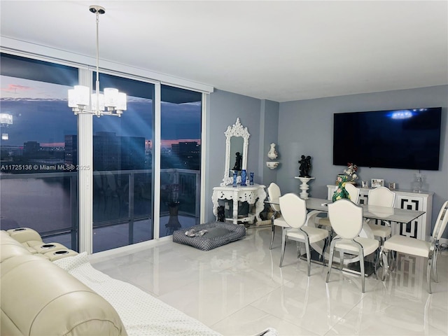 living room with tile patterned floors, an inviting chandelier, and expansive windows