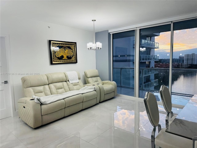 living room featuring a notable chandelier and expansive windows