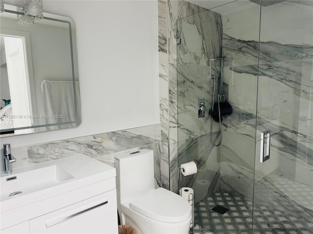 bathroom featuring an enclosed shower, vanity, and toilet