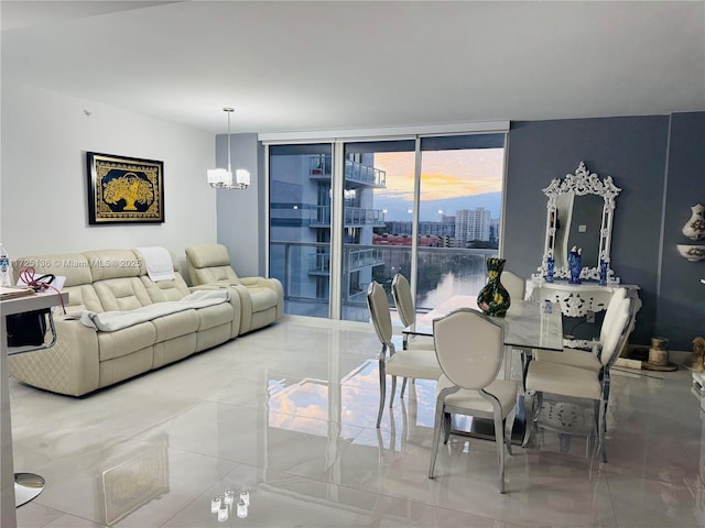 dining space featuring an inviting chandelier and a wall of windows