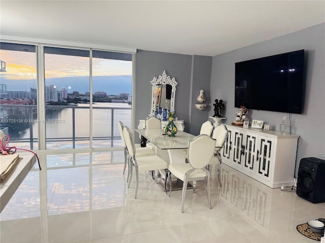 tiled dining room with floor to ceiling windows